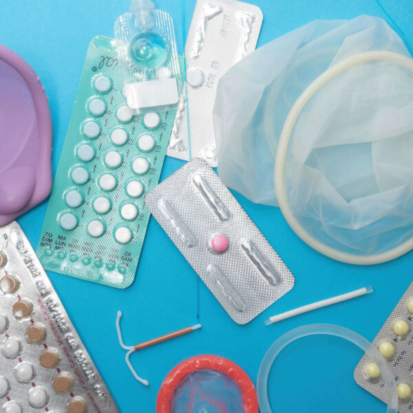 A collection of reproductive health supplies such as birth control pills and condoms